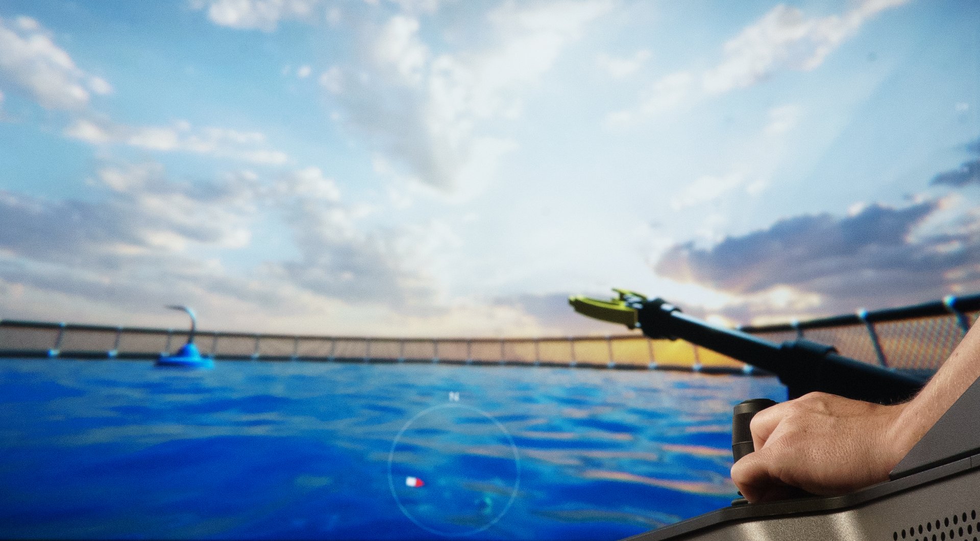 Fotografi av joystick med simulatorspillet i bakgrunnen.